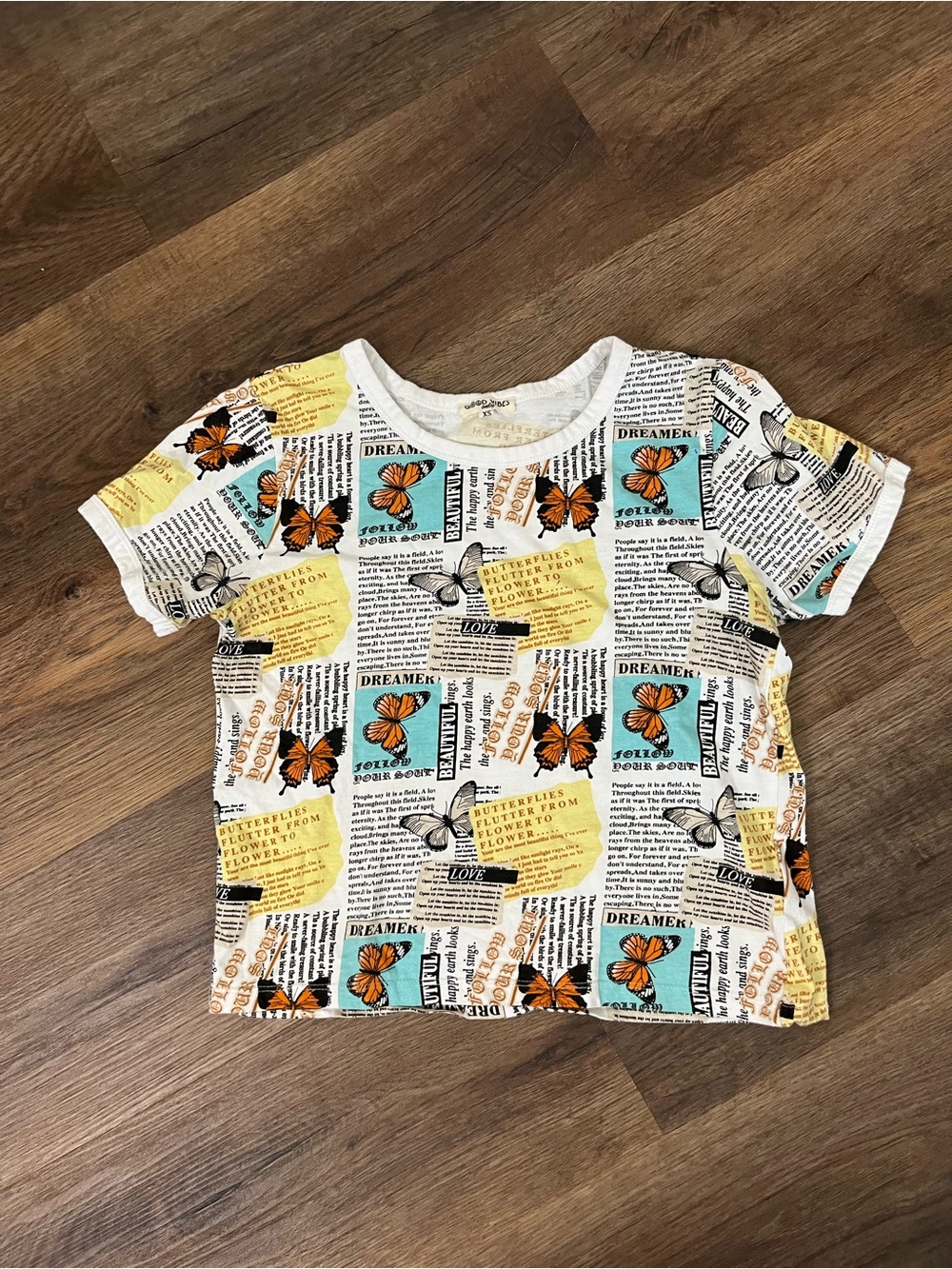 Butterfly & Newsprint Short Sleeve Baby Tee - White with Yellow & Teal Accents